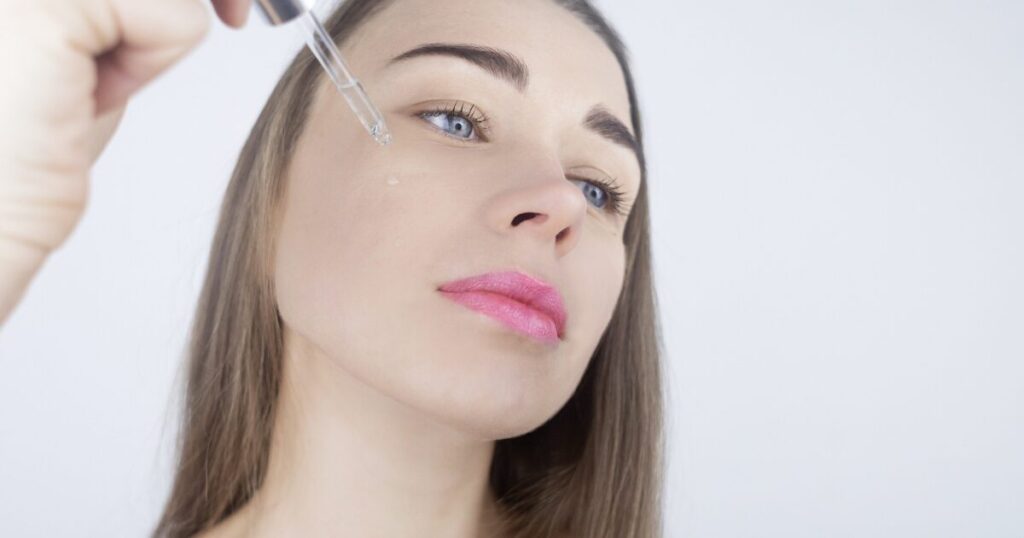 A Girl Applying the Retinol on Her Face